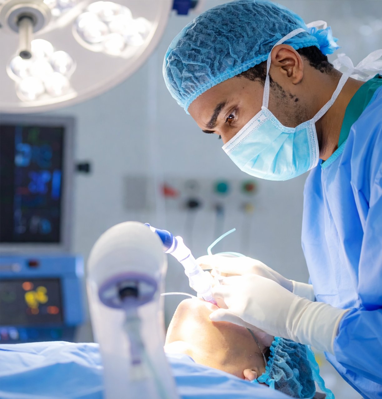 Surgeon performing a precise procedure under surgical lights in a nursing home operation theatre.