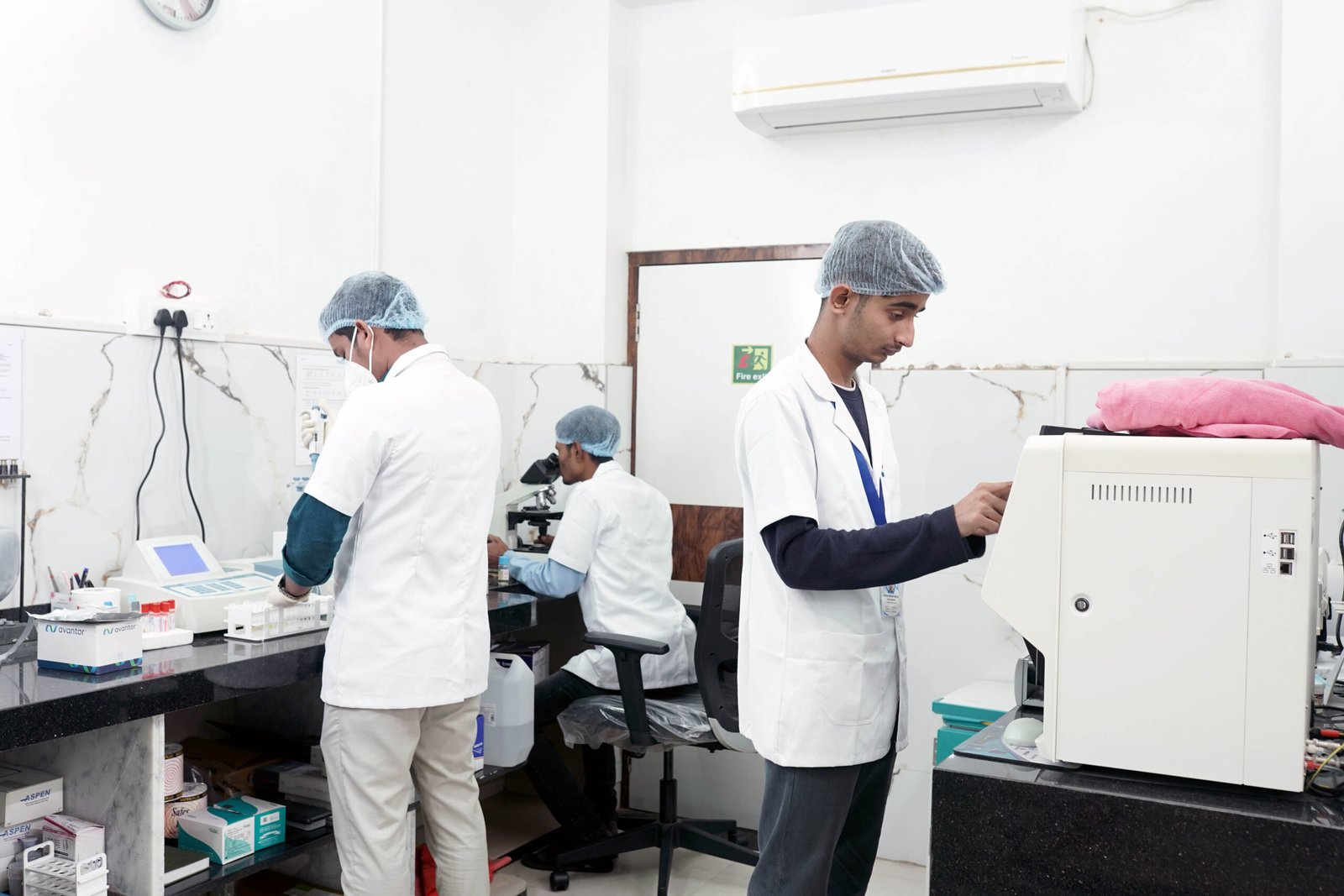Laboratory technicians conducting diagnostic tests and analysis in a nursing home lab.