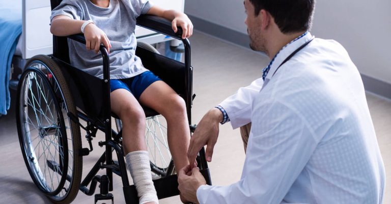 male-doctor-interacting-with-child-patient-in-ward-2021-08-28-17-19-07-utc.jpg